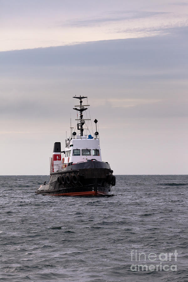 Tugboat Floating In Wait On Calm Ocean At Anchor Photograph