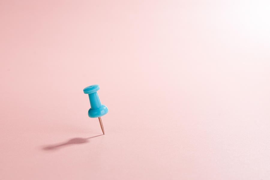 Turquoise Thumbtack Against Pink Colored Background Photograph by MirageC
