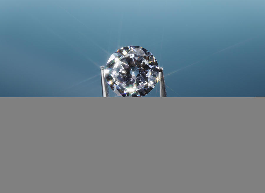 Tweezers holding diamond, close-up Photograph by Jeffrey Hamilton