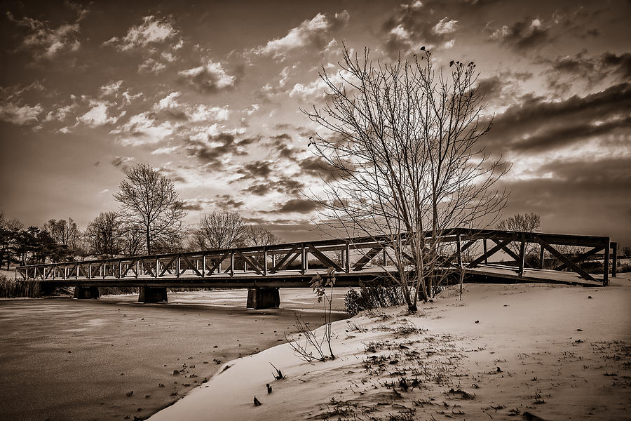 Twilight Bridge over an icy pond - BW Photograph by Chris Bordeleau