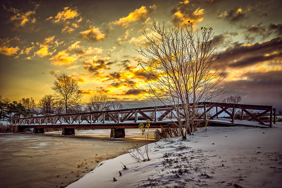 Twilight Bridge over an icy pond Photograph by Chris Bordeleau