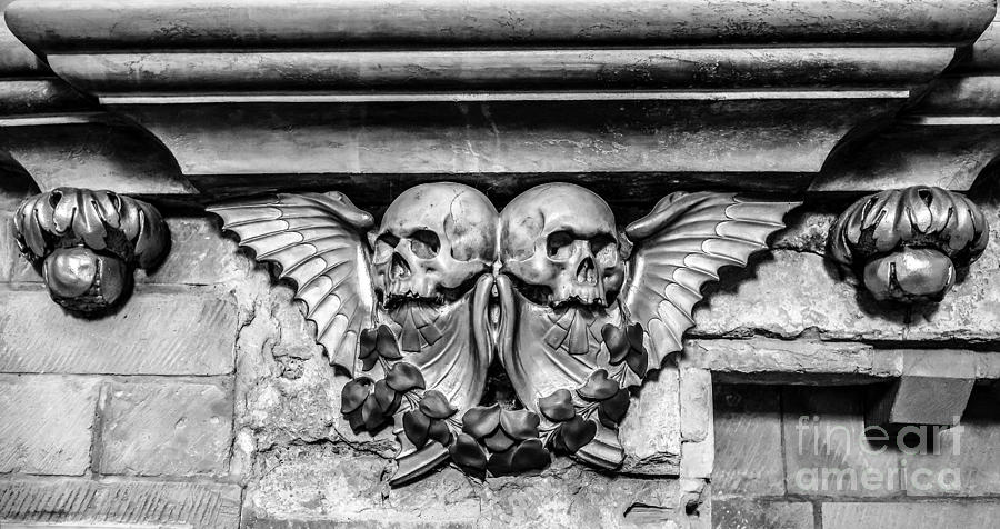 Black And White Photograph - Twin Winged Skull with Laurel Detail - Southwark Cathedral - London - England - Black and White by Ian Monk