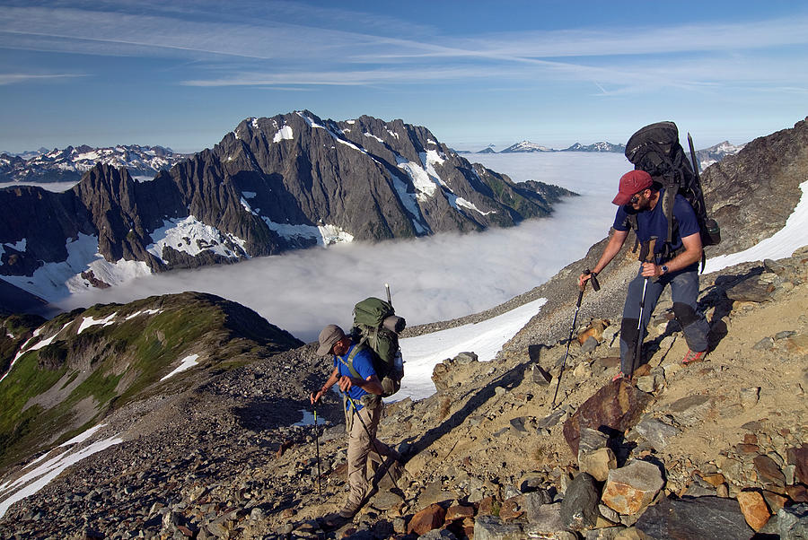 North Cascades National Park Photograph - Two Backpackers Scramble Down The Trail by Cliff Leight
