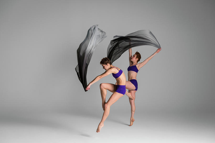 Two Ballerinas Dancing Wile Holding Photograph by Nisian Hughes