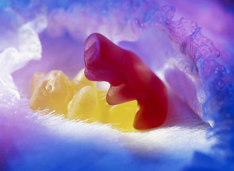 Two bear-shaped sweets embracing, close-up Photograph by Christian Adams