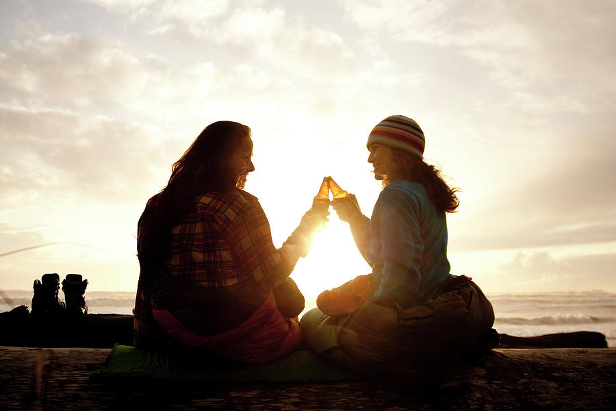 Sunset Photograph - Two Beautiful Women And Toast A Beer by Jordan Siemens