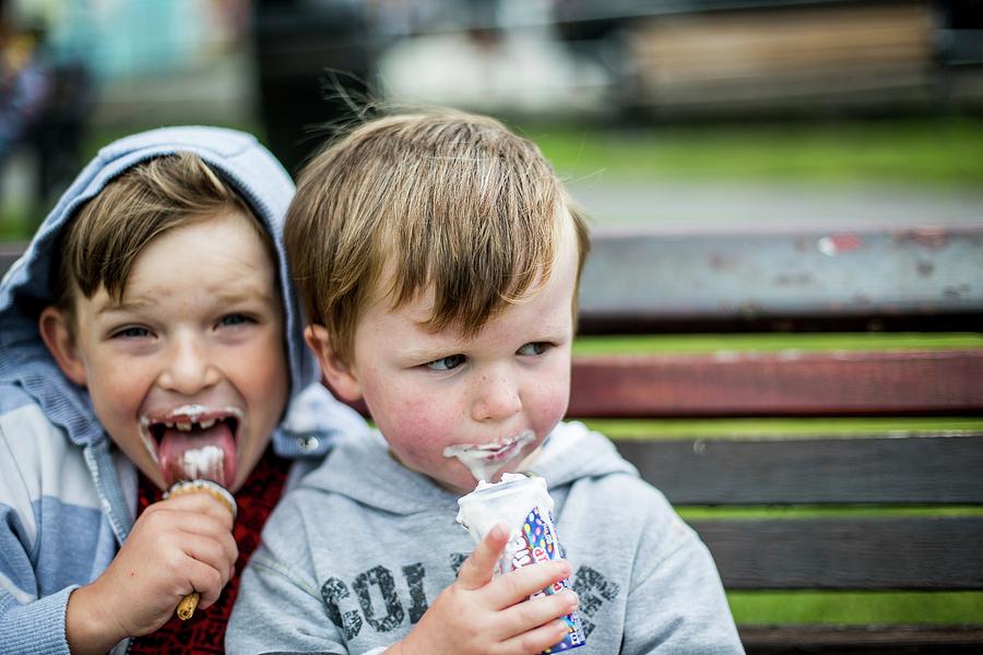 Two Boys Eating Ice Creams Photograph by Samuel Ashfield