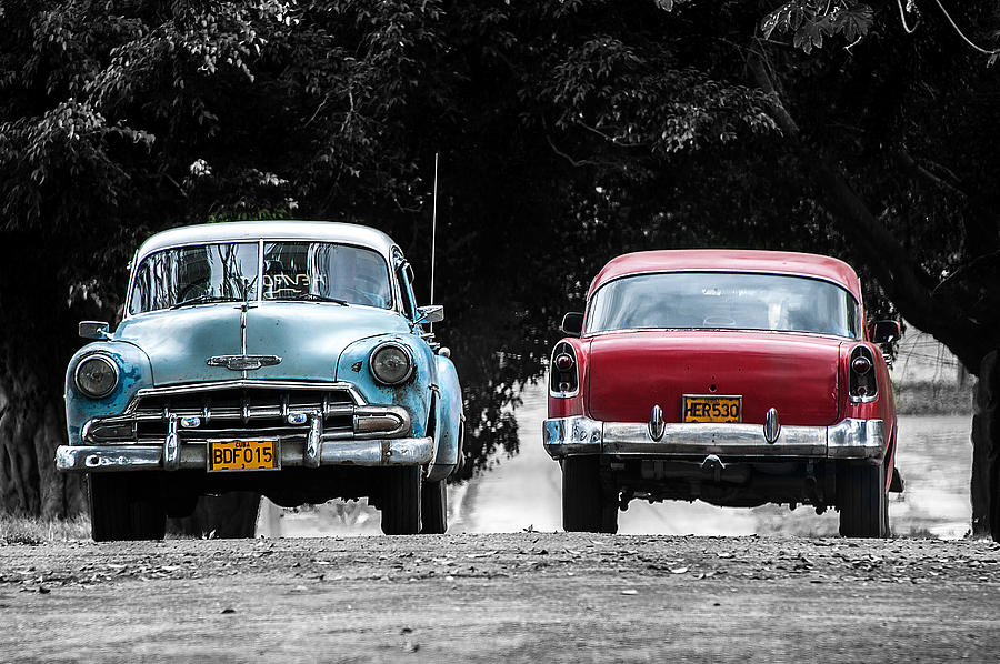 Two cars passing Photograph by Patrick Boening