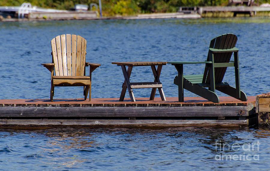 Two chairs on a dock Photograph by Les Palenik