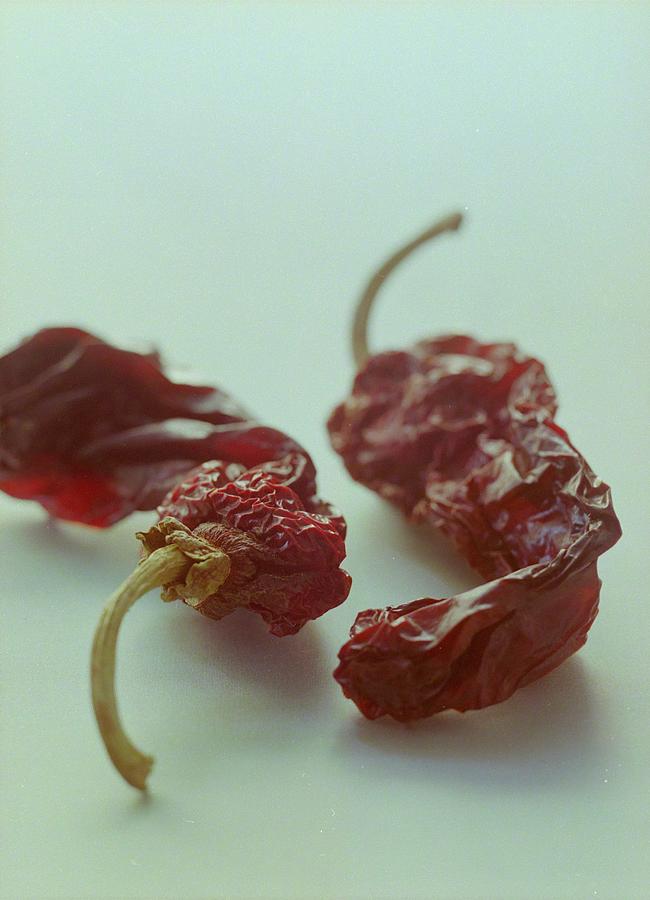 Two Dried Peppers Photograph by Romulo Yanes