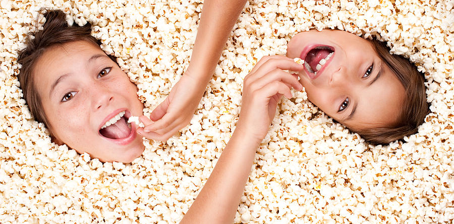 Popcorn Photograph - Two Girls Buried In Popcorn by Xavier Gallego Morell