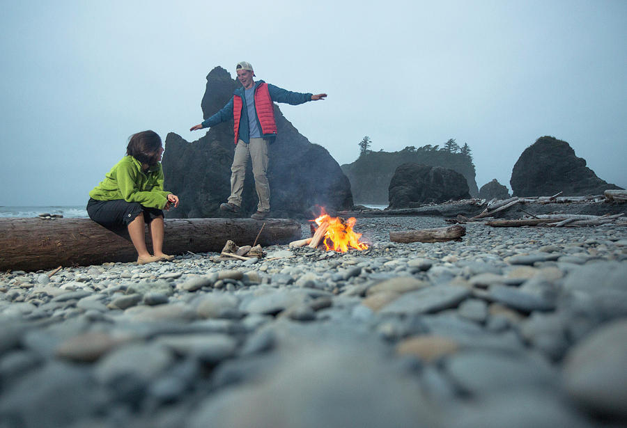 Olympic National Park Photograph - Two Hikers Enjoy A Campfire On A Beach by Matt Andrew