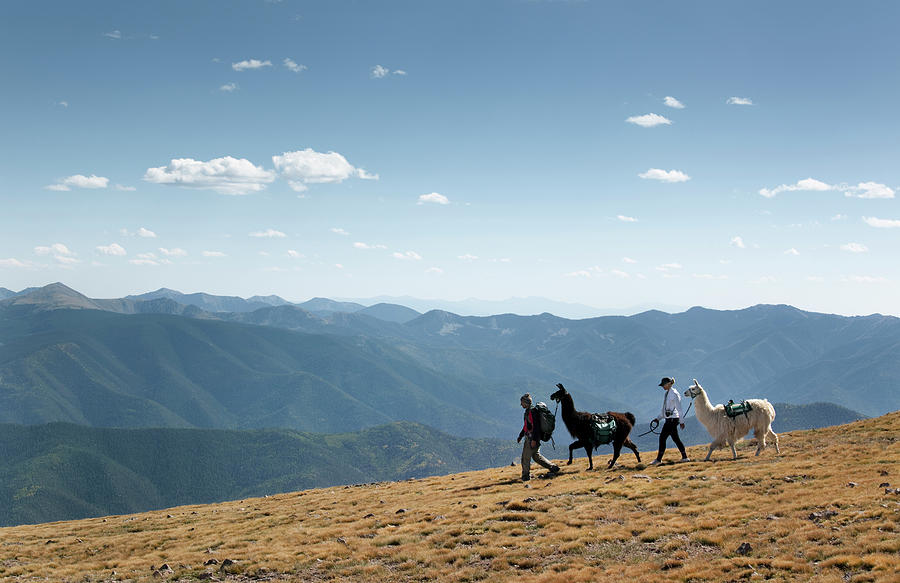 Two Hikers Walk Along A Ridge Photograph by Ryan Heffernan - Fine Art ...