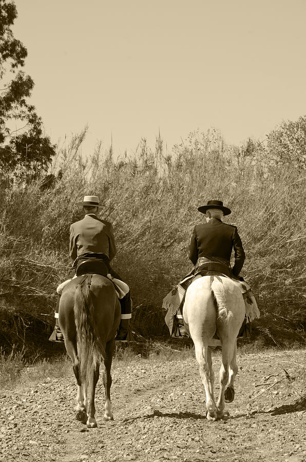Two horsemen in riverbed Photograph by Perry Van Munster