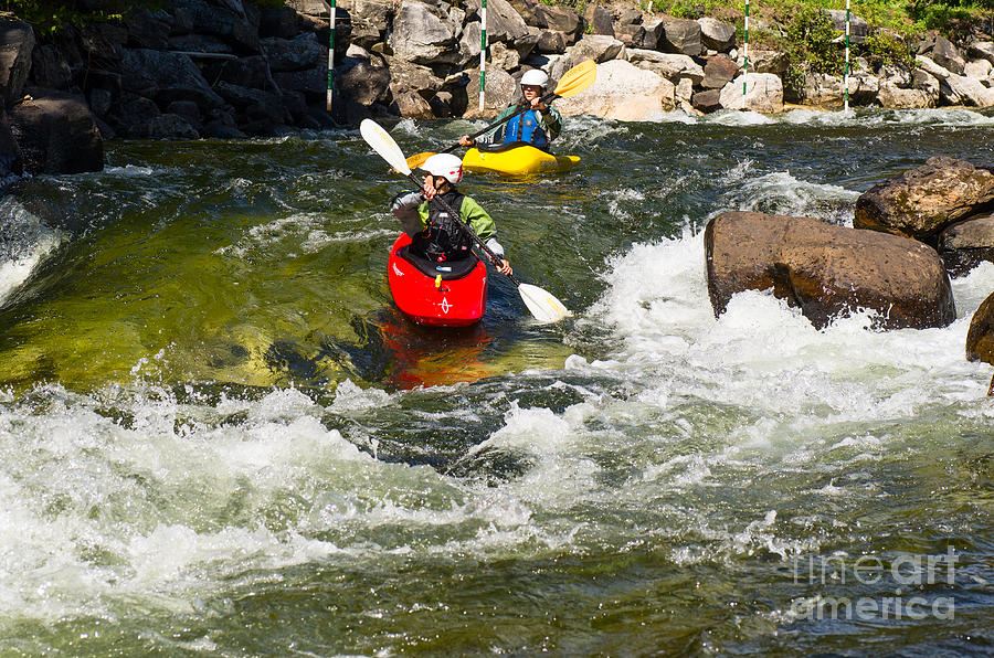 Two kayakers on a whitewater course Photograph by Les Palenik