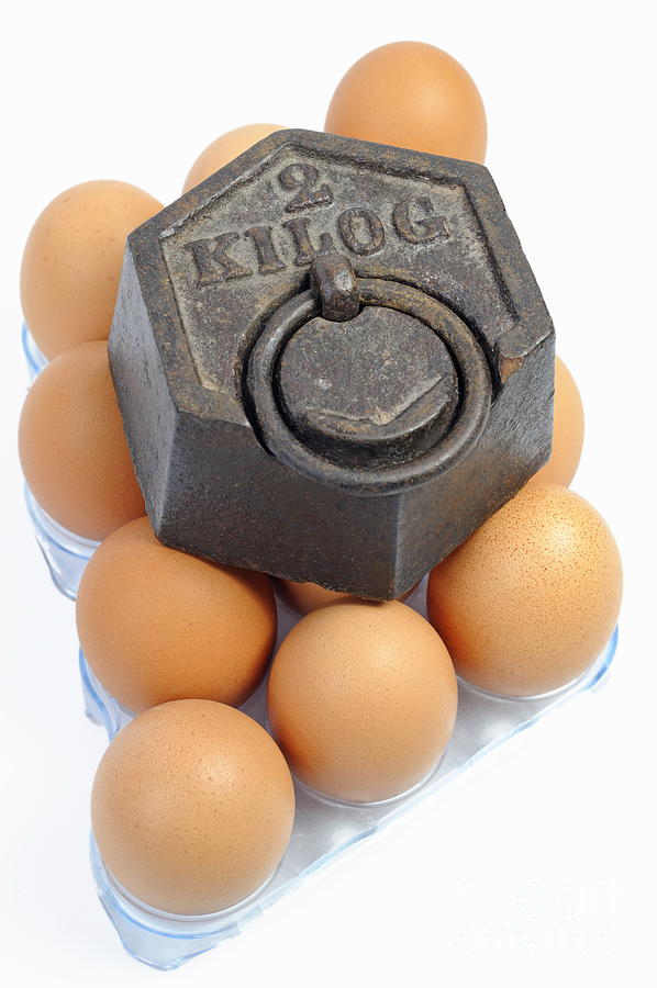 Two kilos weight on eggs Photograph by Sami Sarkis Photography Two kilos weight on eggs Photograph by Sami Sarkis Photography
