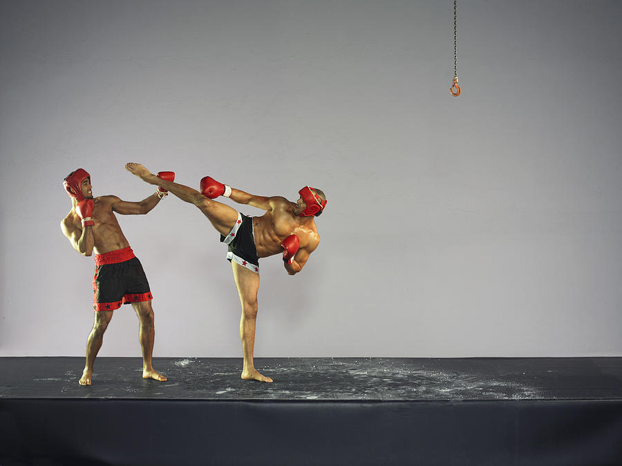 Two Male Kick Boxers in a Fight Photograph by 10000 Hours