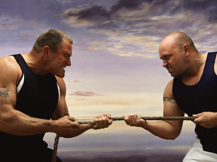 Two Men Competing Against Each Other in a Tug of War Photograph by John Slater