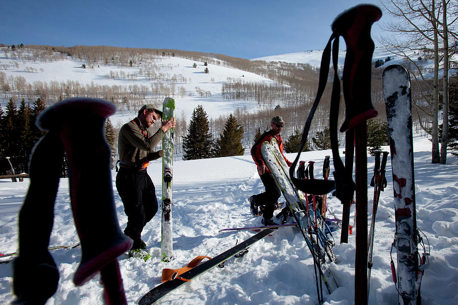 Winter Photograph - Two Men Getting Their Skis Ready by Trevor Clark