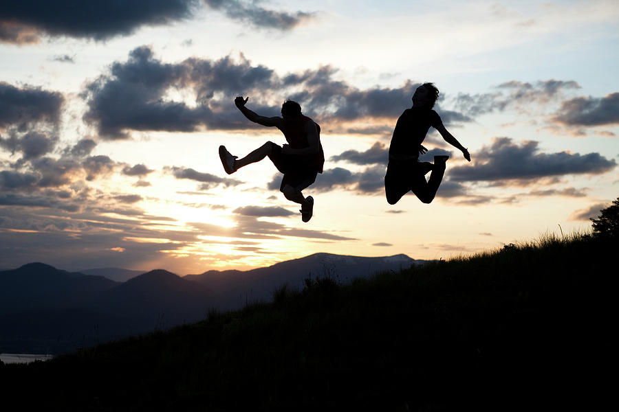 Two Men Jumping At Sunset In Idaho Photograph by Patrick Orton - Fine ...