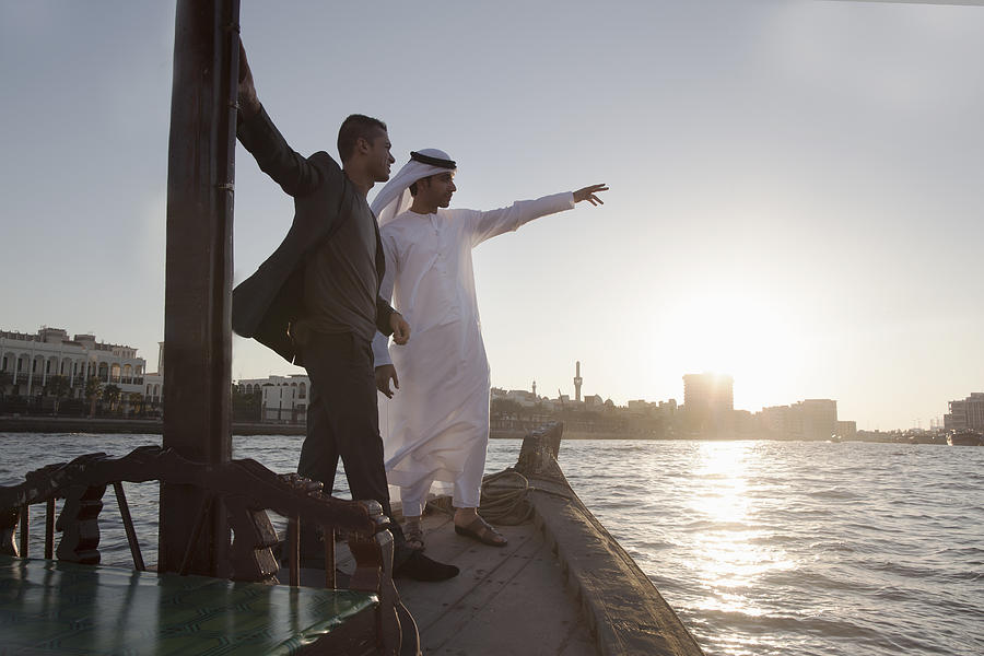 Two Middle Eastern Businessmen, Dubai Creek Photograph by Gary John Norman