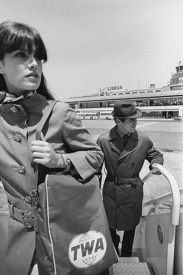 Two Models Boarding A Plane Photograph by Leonard Nones