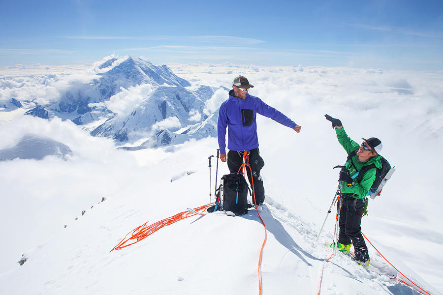 Two Mountaineers Are Giving A High Five Photograph by Menno Boermans ...