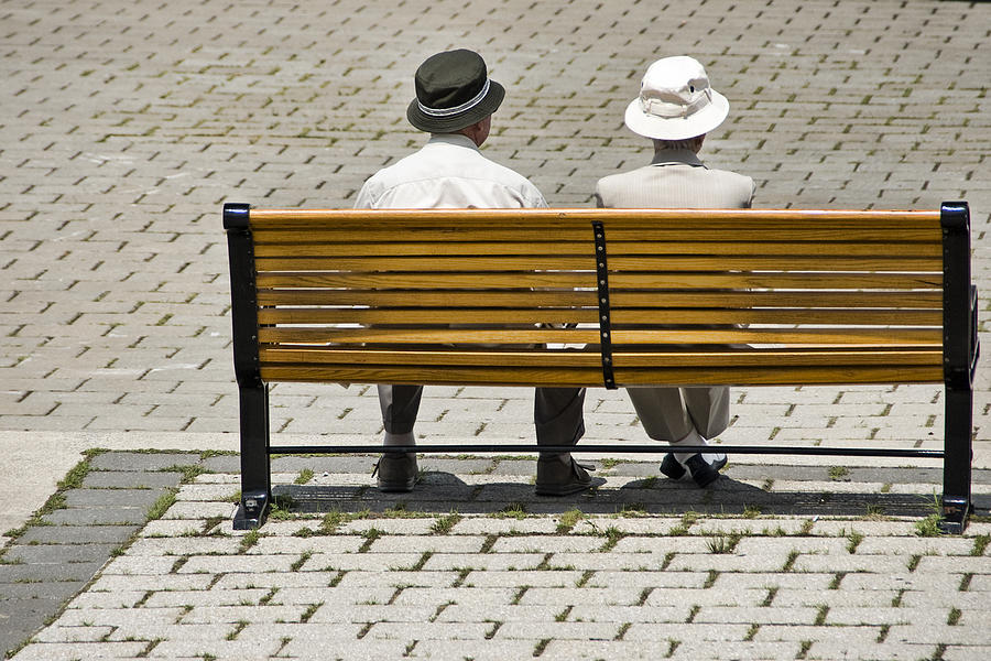 Two people seated on a bench Photograph by Randall Nyhof
