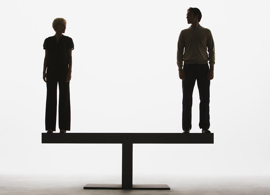 Two people standing on top of a plank Photograph by Martin Barraud