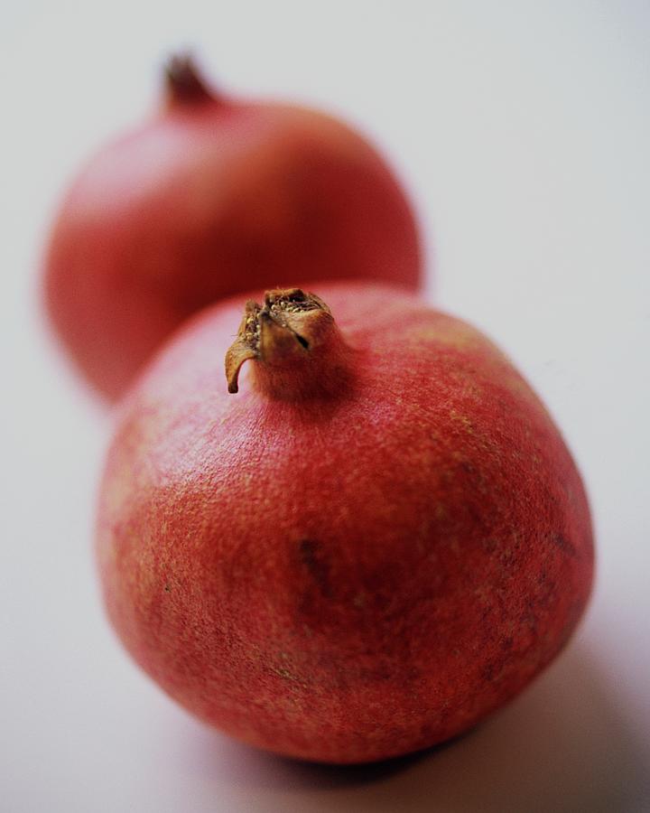 Two Pomegranates Photograph by Romulo Yanes