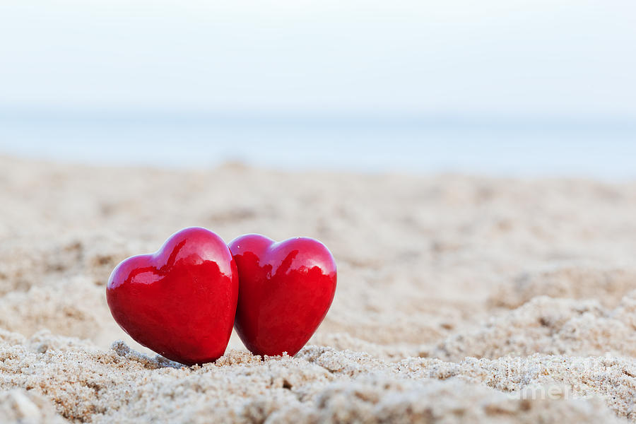 Two red hearts on the beach symbolizing love Photograph by Michal Bednarek
