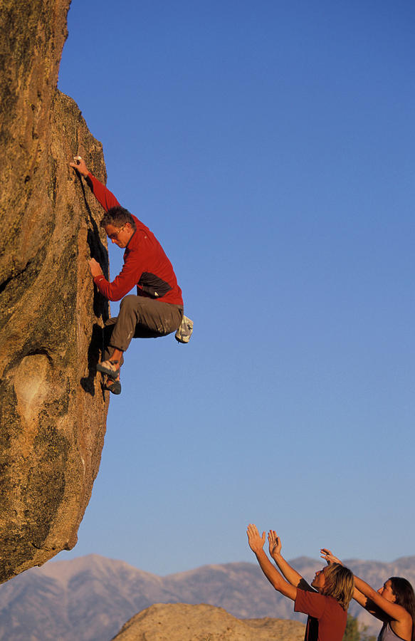 Two Rock Climbers Spot A Man Climbing Photograph By Corey Rich Fine Art America