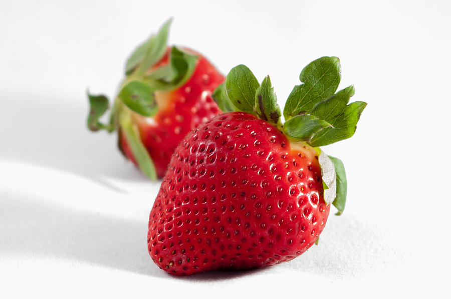 Two strawberries isolated on white background Photograph by Alex Grichenko