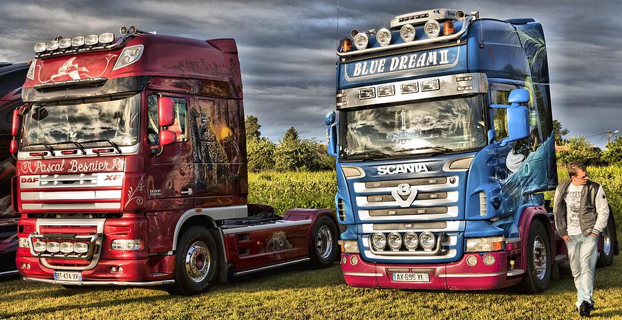 Two European cabover trucks at show in France. DAF and Scania Photograph by Mick Flynn