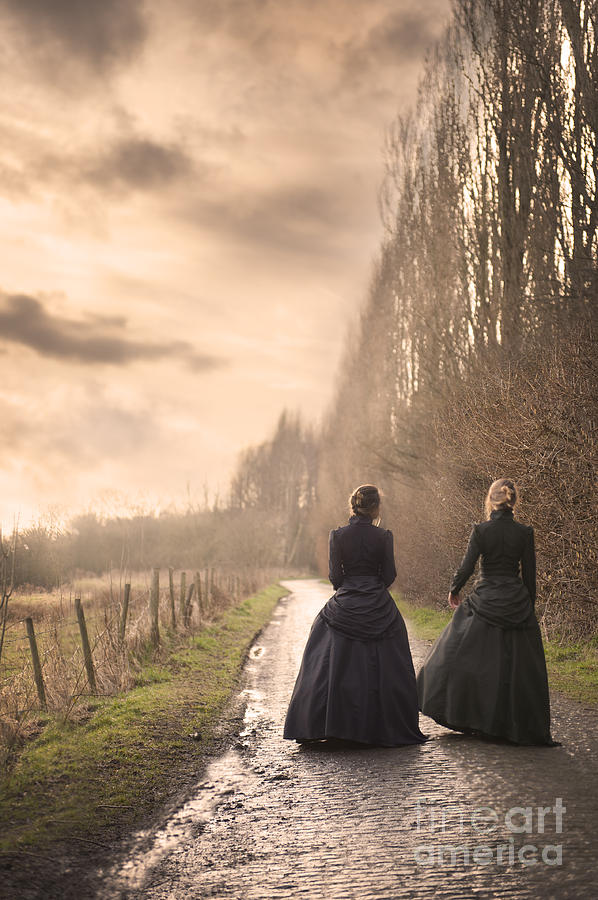 Two Victorian Ladies Walking On A Cobbled Path Photograph By Lee Avison