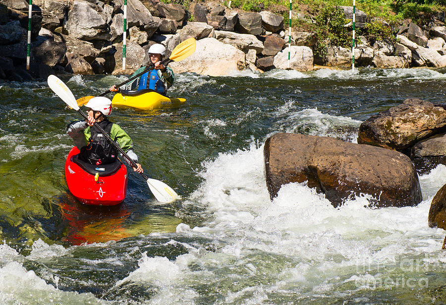 Two whitewater kayaks Photograph by Les Palenik