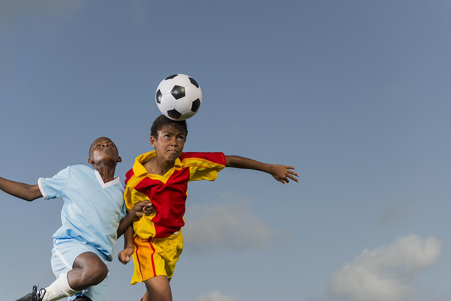 Two Young Boys Playing Football Photograph by Isitsharp Two Young Boys Playing Football Photograph by Isitsharp