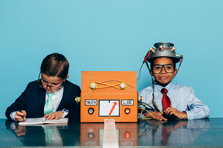 Two Young Businessman with Lie Detector Photograph by RichVintage