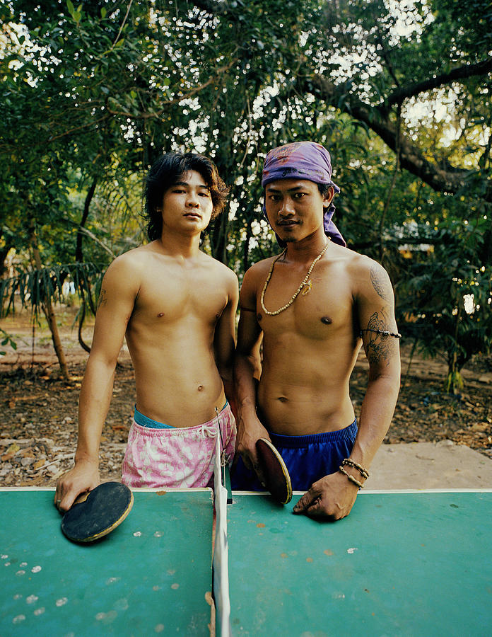 Two Young Men Standing By Table Tennis Holding Bats, Portrait Photograph by Daniel Swallow Two Young Men Standing By Table Tennis Holding Bats, Portrait Photograph by Daniel Swallow
