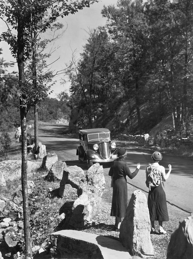 Two Young Women Hitchhiking Photograph by Underwood Archives