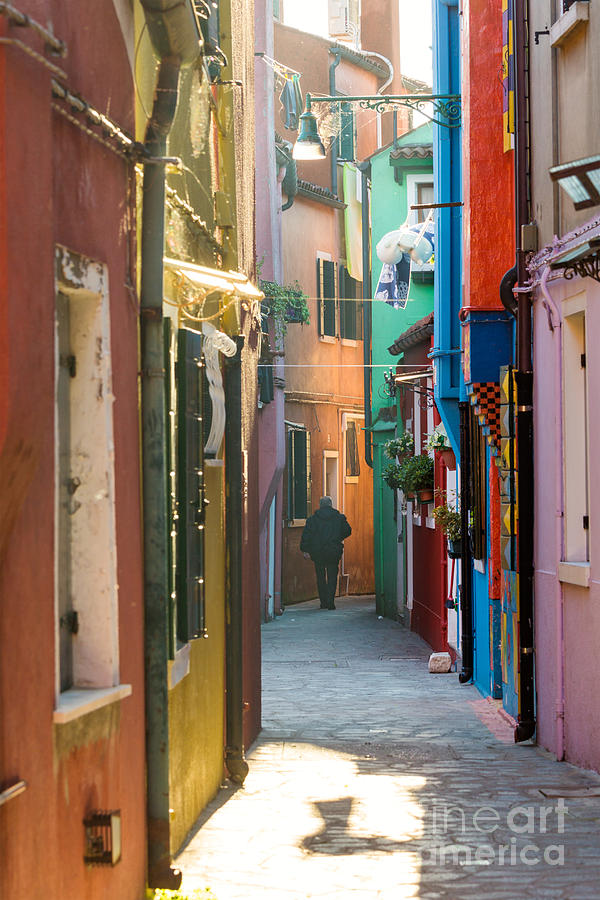 Typical street with colorful houses in Burano - Venice Photograph by Matteo Colombo
