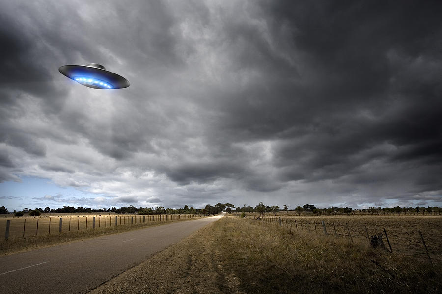 UFO on Country Road Photograph by Aaron Foster