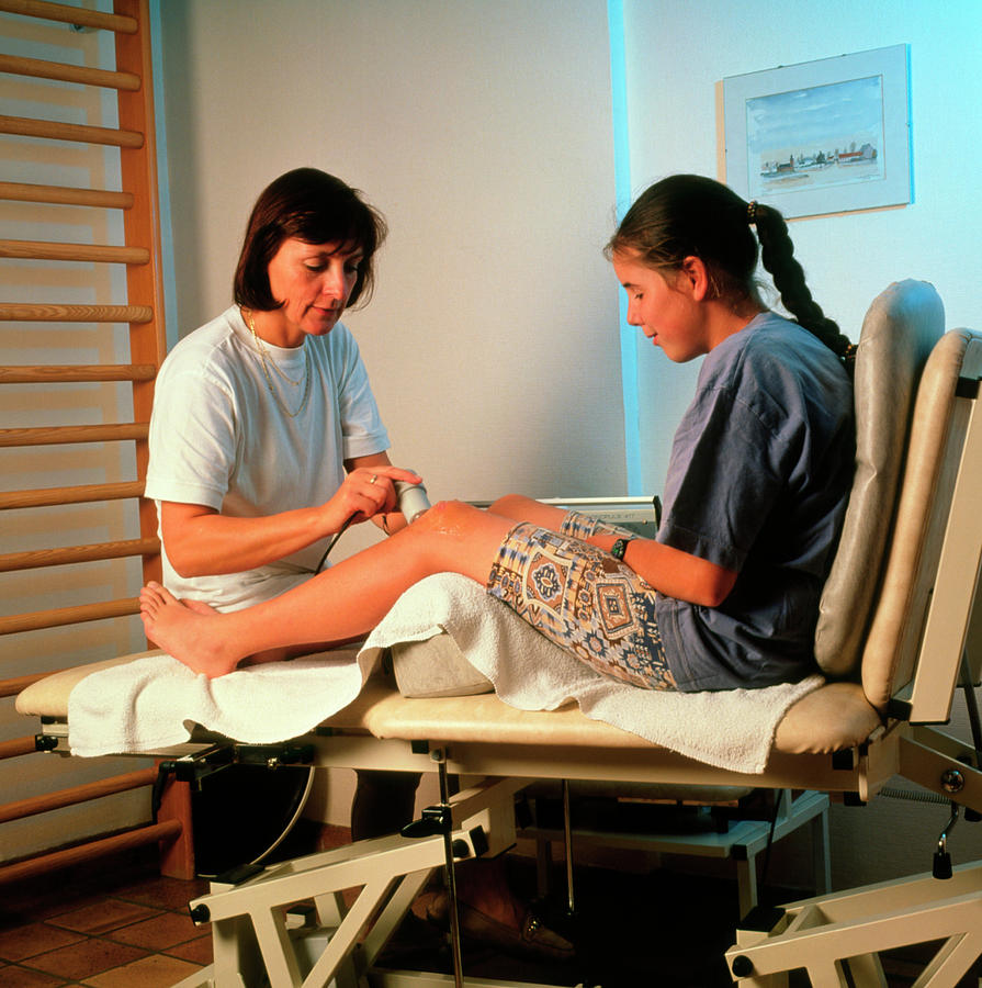 Ultrasound Physiotherapy On A Girls Knee Photograph by Cc Studio/science Photo Library