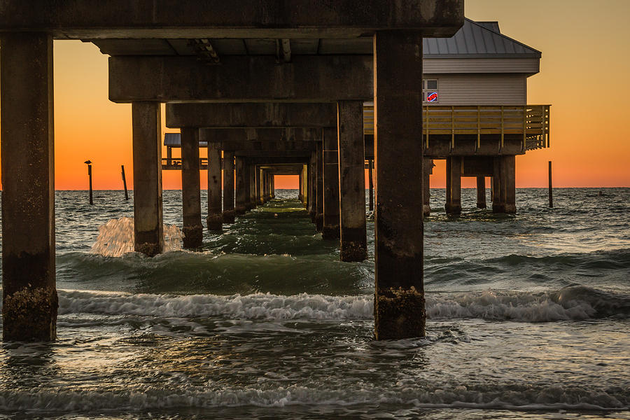 Under the pier Photograph by Jane Luxton