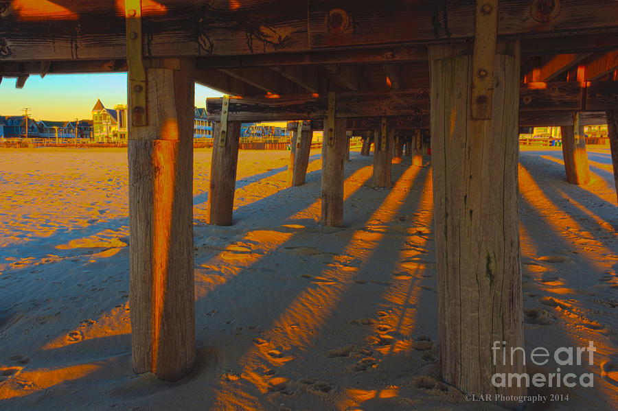 Under the pier shadows Photograph by Lucy Raos
