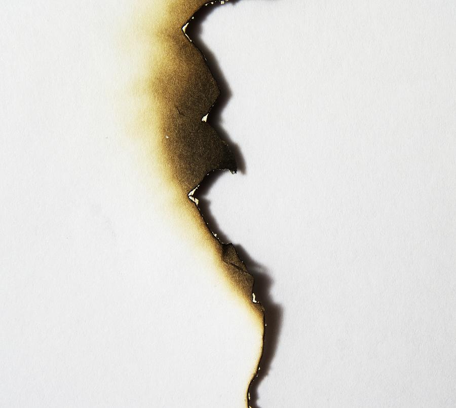 Uneven burned edge of a piece of paper Photograph by Walrusmail