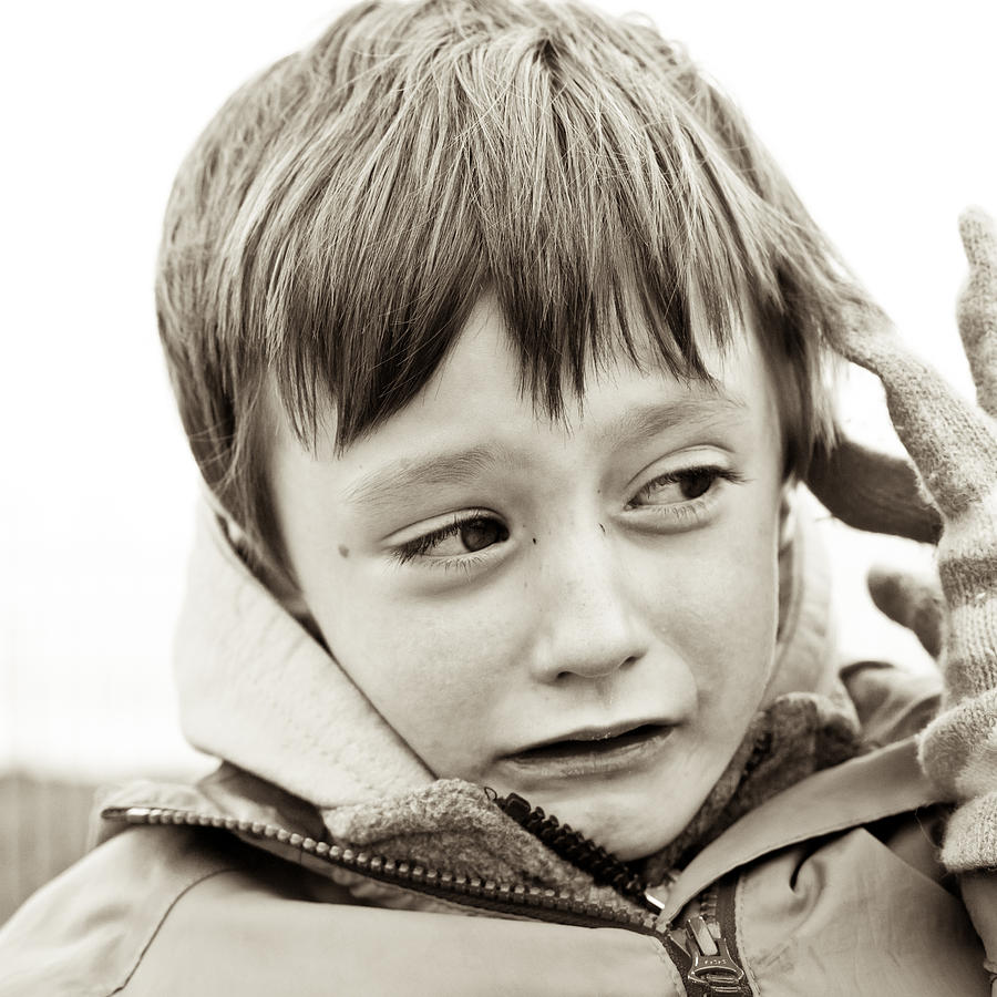 Black And White Photograph - Unhappy boy by Tom Gowanlock