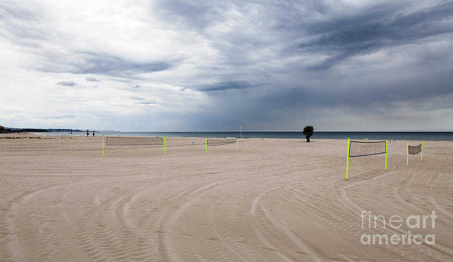 Unoccupied Beach Vollyball Nets On An Overcast Empty Beach Photograph by Peter Noyce