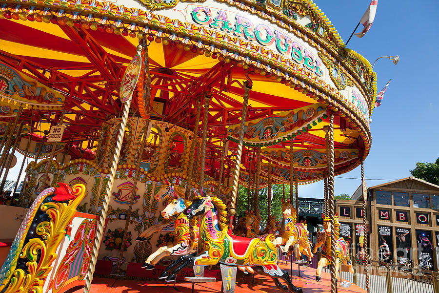 Unoccupied traditional carousel fair ground ride. Photograph by Peter Noyce