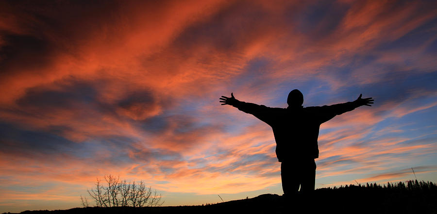 Unrecognizable Man With Arms Outstretched in Worship Photograph by ImagineGolf